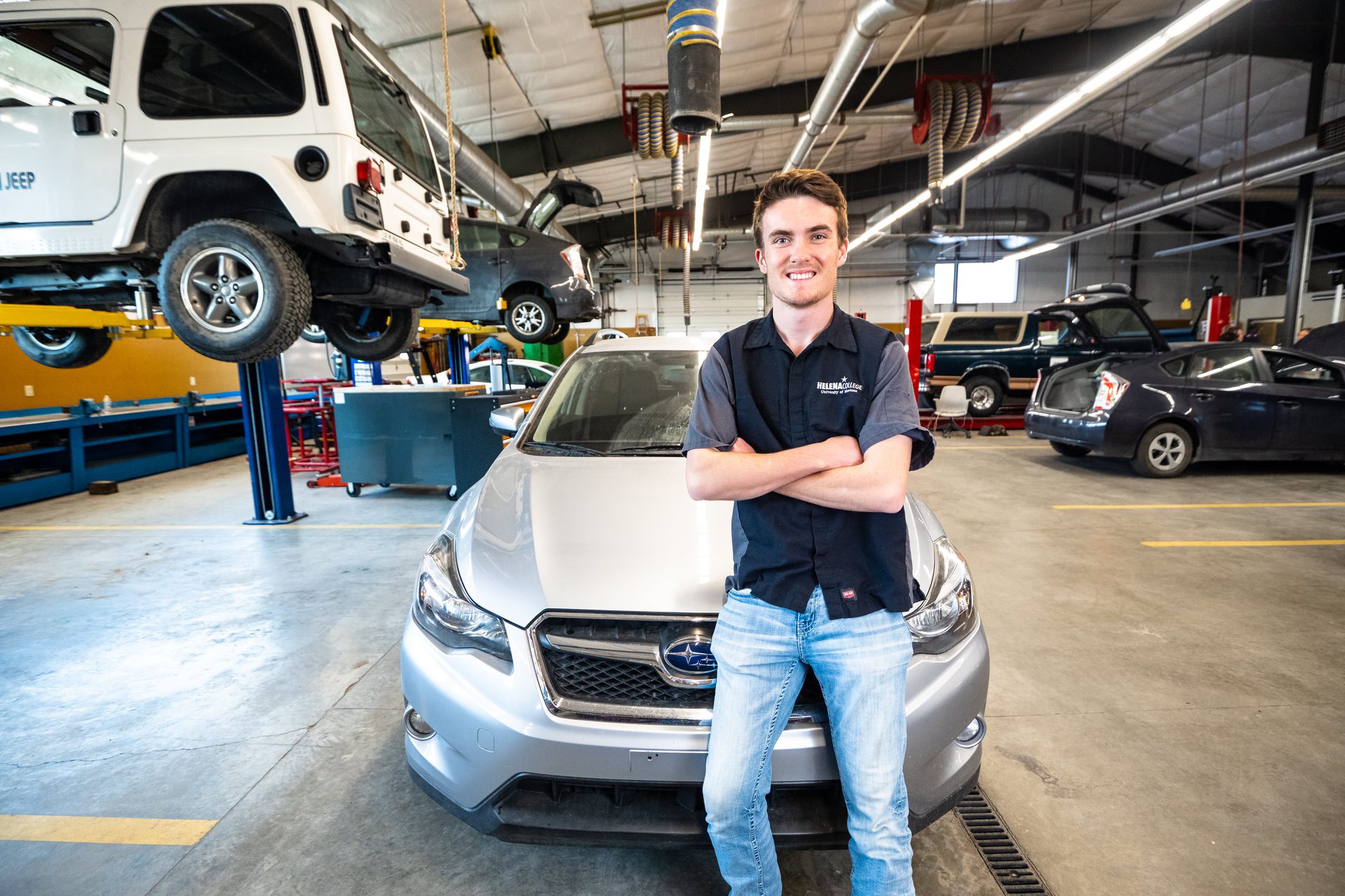 Automotive technology student standing in the Donaldson Campus shop